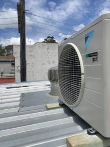 AC outdoor unit installed on the roof