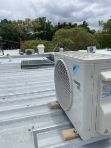Split system outdoor unit installed on a roof