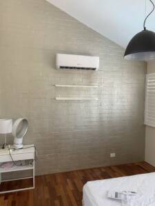 Wall mounted split system installed in a house