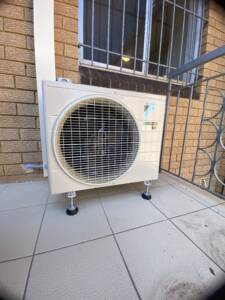 Zena outdoor ac unit installed on a balcony
