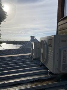 Outdoor ac unit installed on a roof at Rose Bay