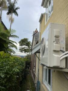 Outdoor AC unit installed on wall brackets at Bondi area