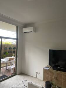 Wall mounted air conditioner installed in apartment at Bondi