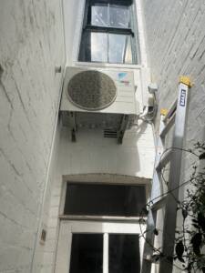 Daikin outdoor AC unit installed on wall brackets at Bronte