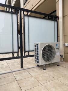 Outdoor AC unit installed on a balcony at Bondi