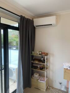 Wall mounted air conditioner installed in apartment at Bondi